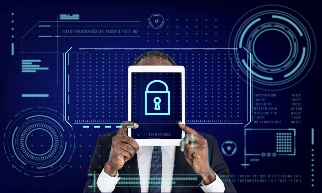 Person holding a tablet that shows a padlock, in front of a blue digital interface, illustrating identity security