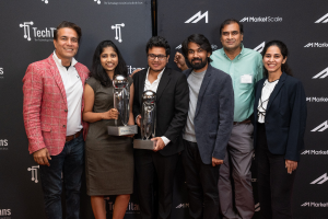 The DigitalXForce team receiving an award on stage