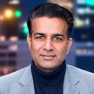 Lalit Ahluwalia, CEO and Founder of DigitalXForce, in a light jacket over a dark turtleneck.